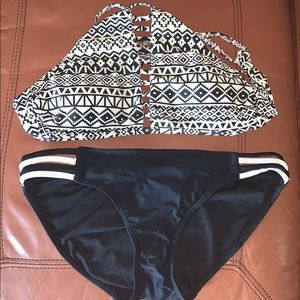 Black a white bathing suit.